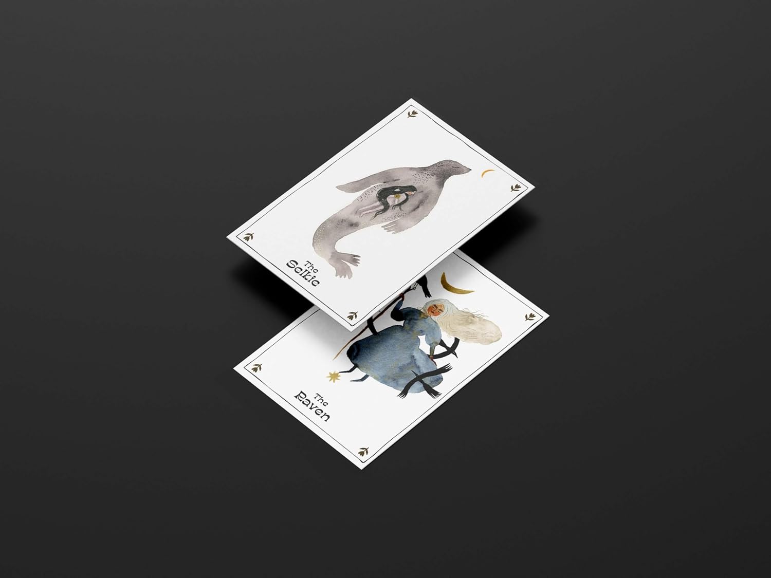 Two tarot cards with illustrations of a bird and a person on a dark background