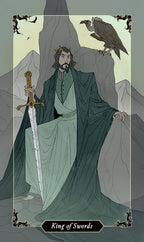 King of Swords tarot card with a figure holding a sword and a bird in a mountainous landscape