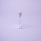 Rectangular glass object on a light purple background