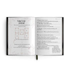Open journal with instructions and a page with text on a white background