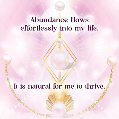 Necklace with pearls and gold chain on a pink background with motivational text.