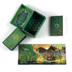 Green card game box with intricate designs on a white background