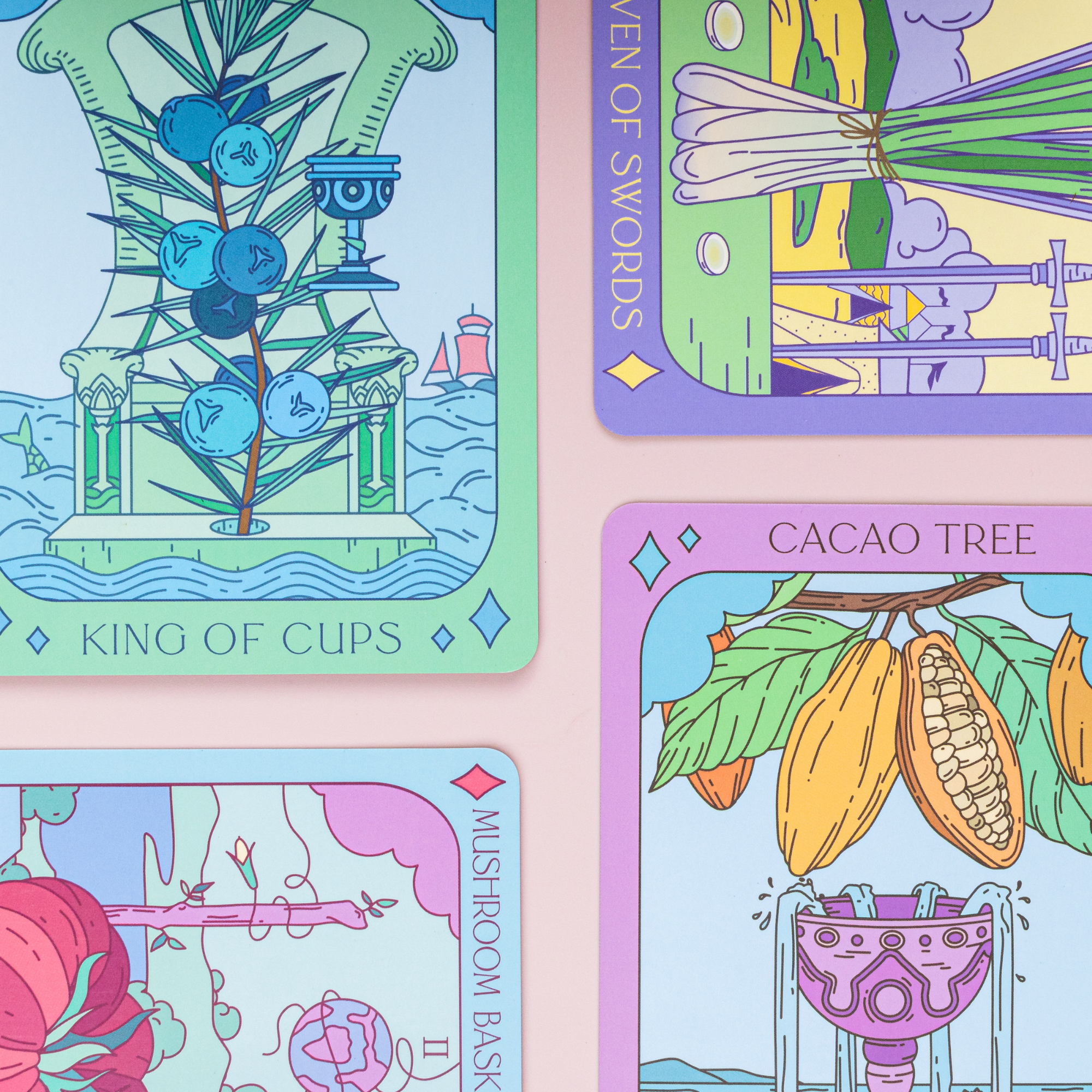 Four colorful tarot cards with intricate designs on a pink background
