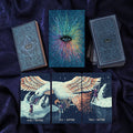 Collection of tarot cards with artistic designs on a dark fabric background