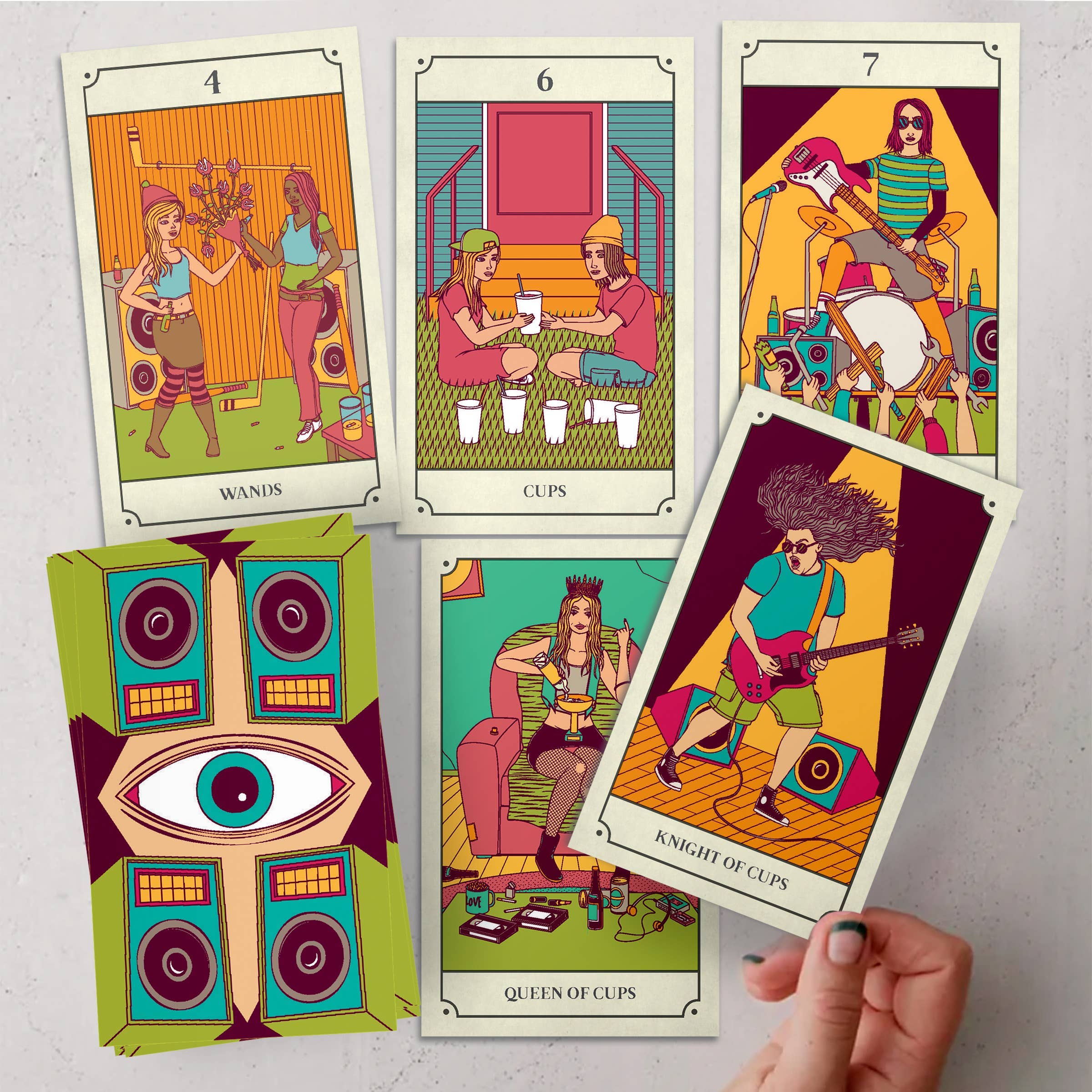 Colorful tarot cards with artistic illustrations on a light gray background