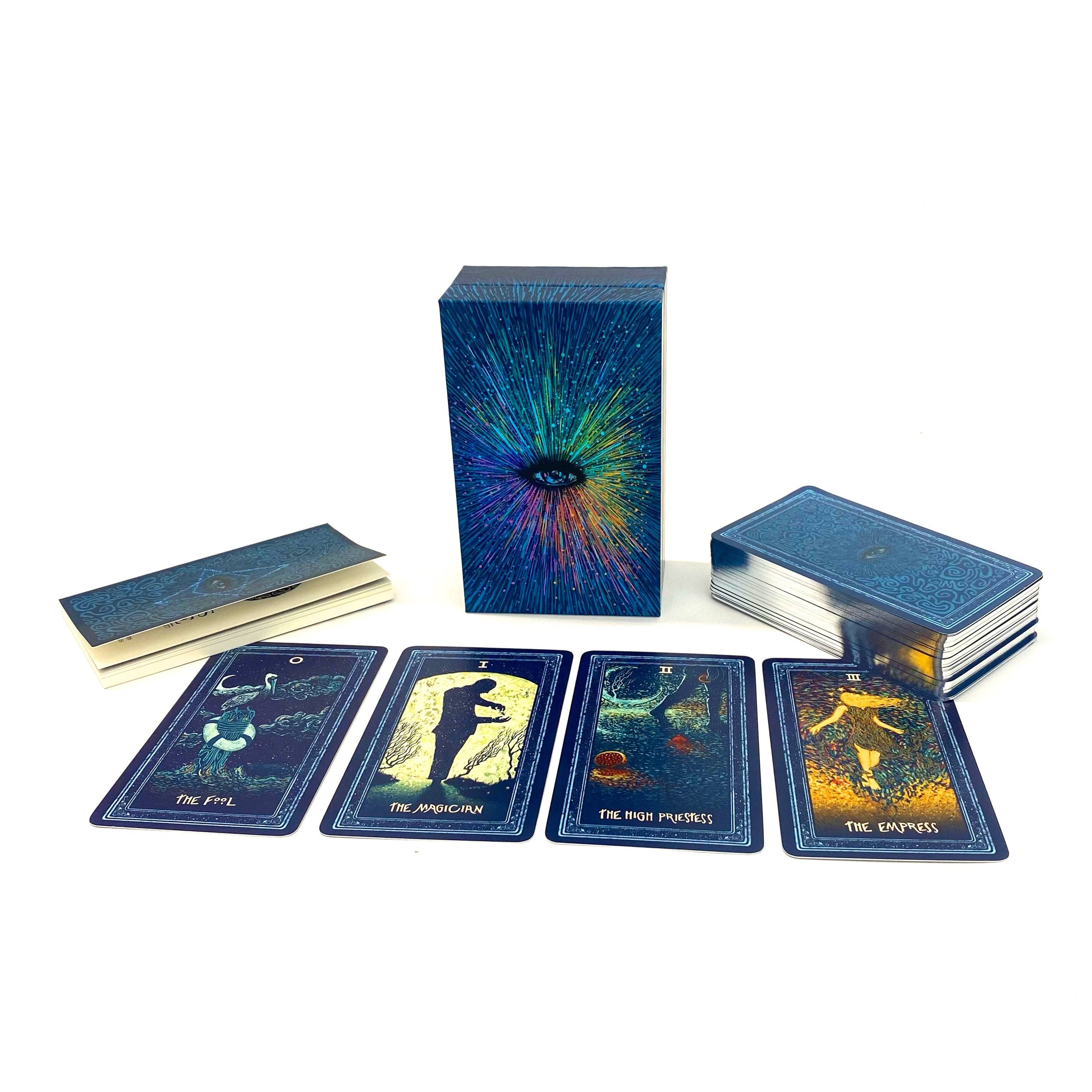 Tarot card set with cards, box, and book on a white background