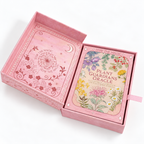 The Plant Guardians Oracle card deck in its pink decorative box, shown open with the card deck inside and the back of the box visible on a white background.