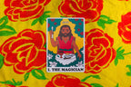 Card featuring 'The Magician' from a tarot deck on a yellow background with red flowers.
