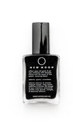 New Moon black crystal healing resin in a clear glass bottle with a black cap, on a white background.