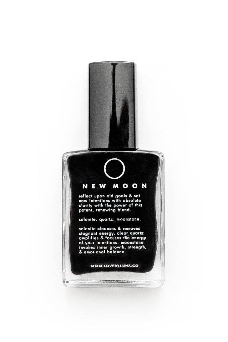 New Moon black crystal healing resin in a clear glass bottle with a black cap, on a white background.