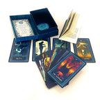 Collection of tarot cards with artistic designs on a white background