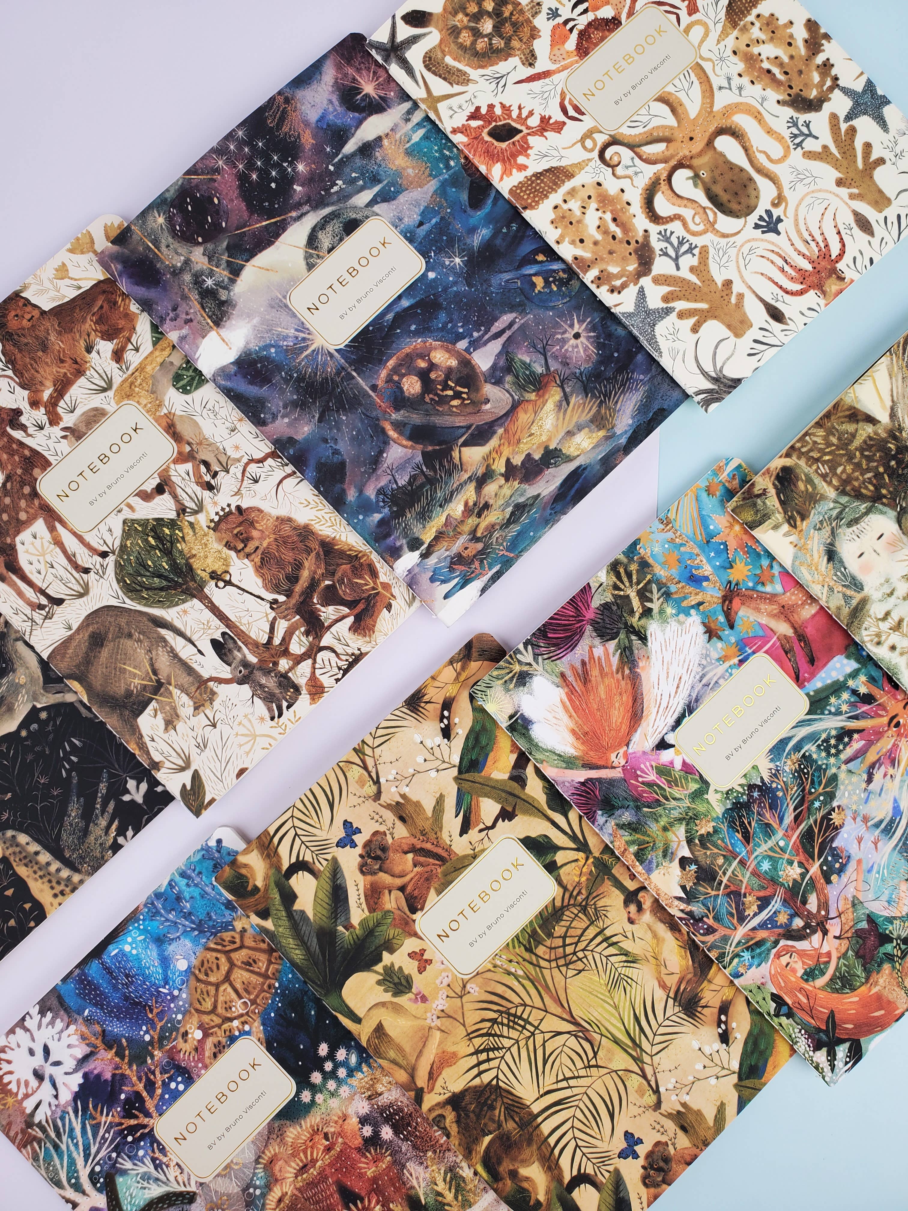 Roll of decorative paper with various patterns including animals, space, and nature.