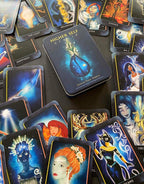Collection of tarot cards with artistic designs on a dark surface