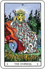 Tarot card featuring 'The Empress' with a woman in a floral dress and crown, holding a heart symbol.