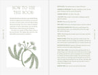 Book open to a page with text and illustrations of plants on a white background