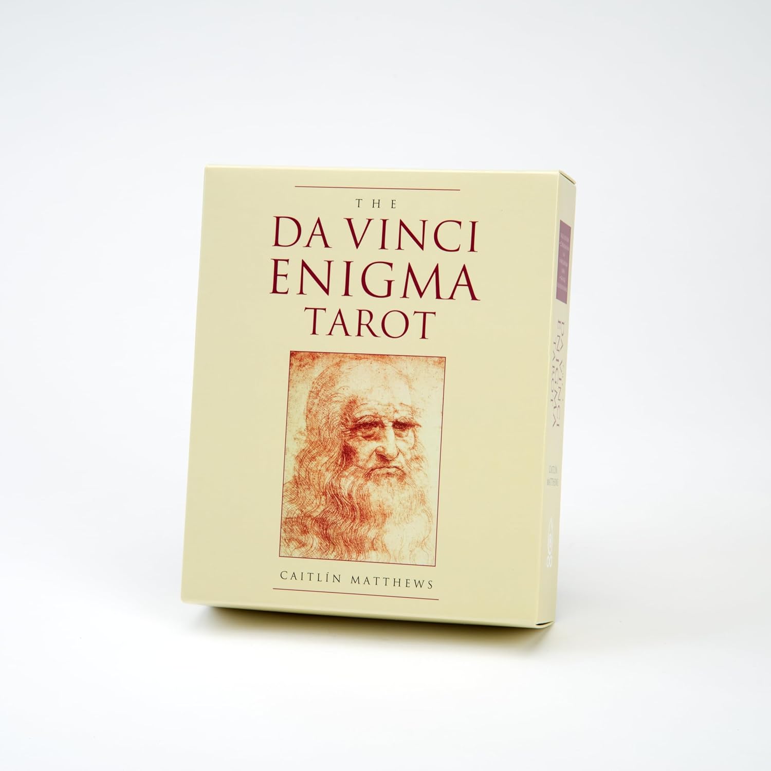 Book titled 'The Da Vinci Enigma Tarot' with a portrait of Leonardo da Vinci on a white background