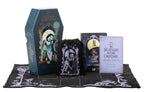 Collection of 'Nightmare Before Christmas' themed items including a coffin-shaped box, drawstring bag, and book on a white background.