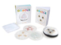 Transparent Oracle card set with packaging on a white background