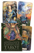 Collection of tarot cards with artistic designs on a black background