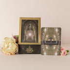 Two tarot cards from 'The Inner Temple Oracle' on a light pink background with flowers.