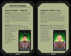 A two-page spread from a card game booklet titled 'SUIT OF CLOAKS,' showing character cards and text for TOMALAK and SELA. The pages have a dark ornate border, beige text panels, and small character portraits at the bottom.
