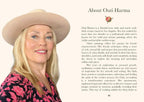 A printed page with a portrait of a woman wearing a beige hat and a bright pink patterned top, alongside the headline 'About Outi Harma' and several paragraphs of text.