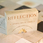 Box of 'Reflection' mindful ritual cards on a textured surface