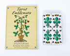 Book titled 'Tarot Emblemata' by Nitasia Roland with a tarot card featuring green emblem design on a white background.