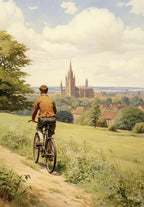 Man riding a bicycle in a countryside setting with a cathedral in the distance