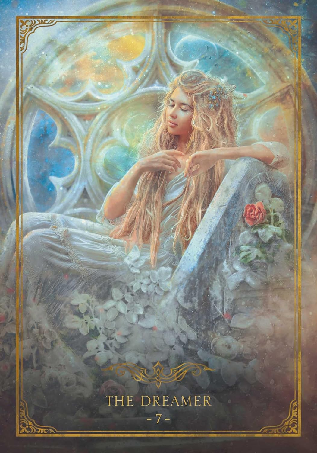 A fantasy-style illustrated card or poster titled "THE DREAMER -7-" shows a seated woman with long blonde hair in a dreamy interior with stained-glass-like windows, flowers, and a rose. The artwork is framed by an ornate gold border.