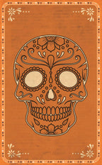 A square orange card or print featuring a decorative sugar skull illustration in dark brown linework, with ornate corner floral motifs and a geometric border.
