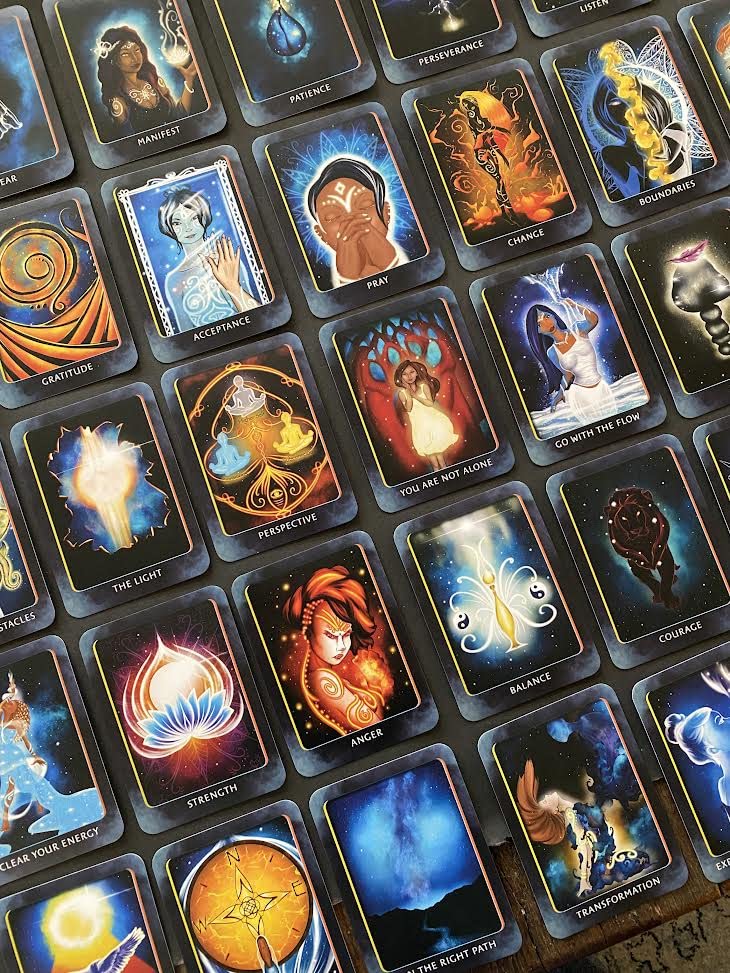 Collection of tarot cards with various designs and colors.