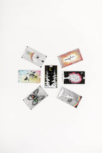 Set of tarot cards with various designs on a white background