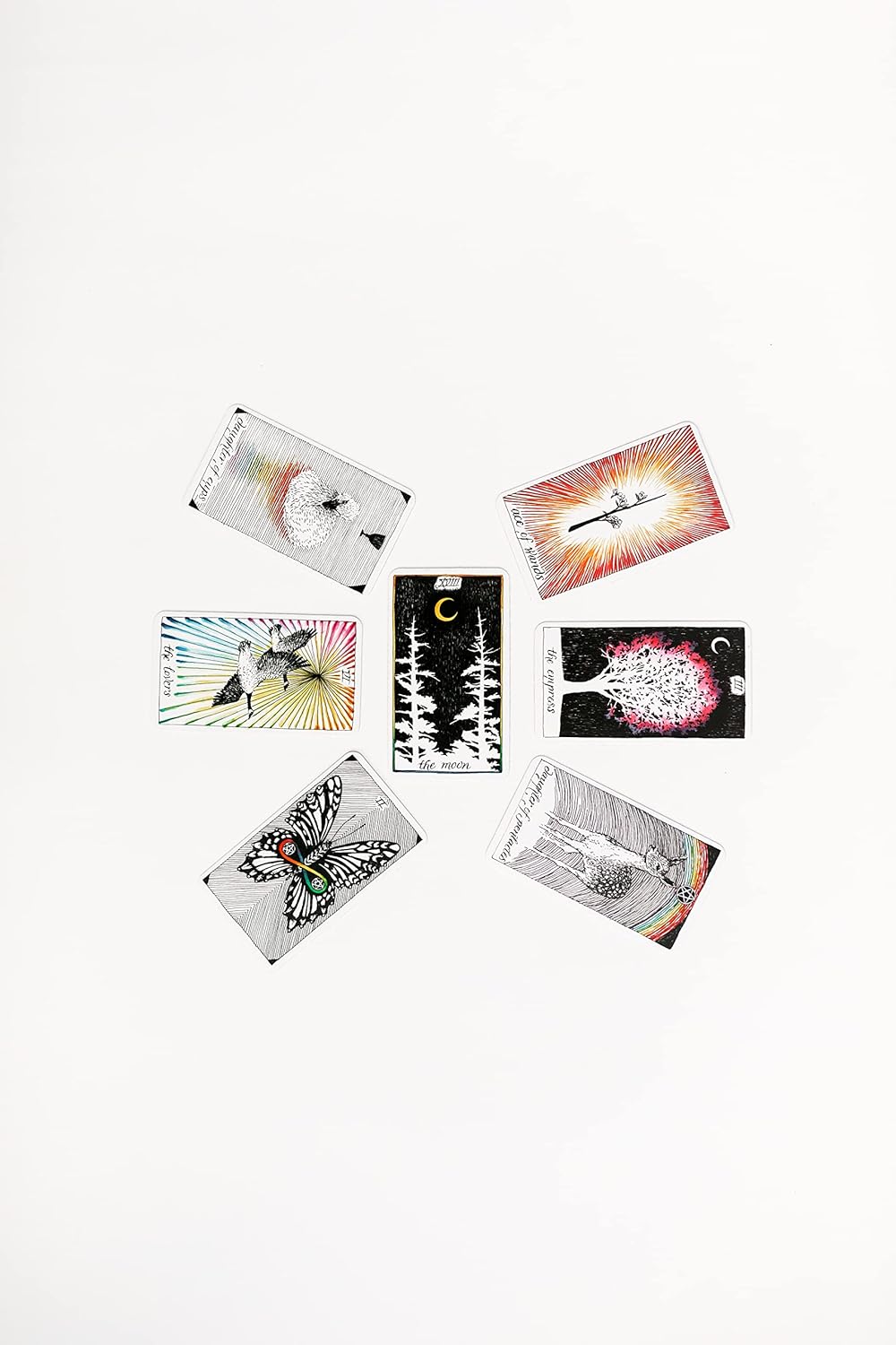 Set of tarot cards with various designs on a white background