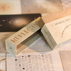 Two wooden boxes labeled 'Reflection' and 'Mindful Rituals' on a textured surface.