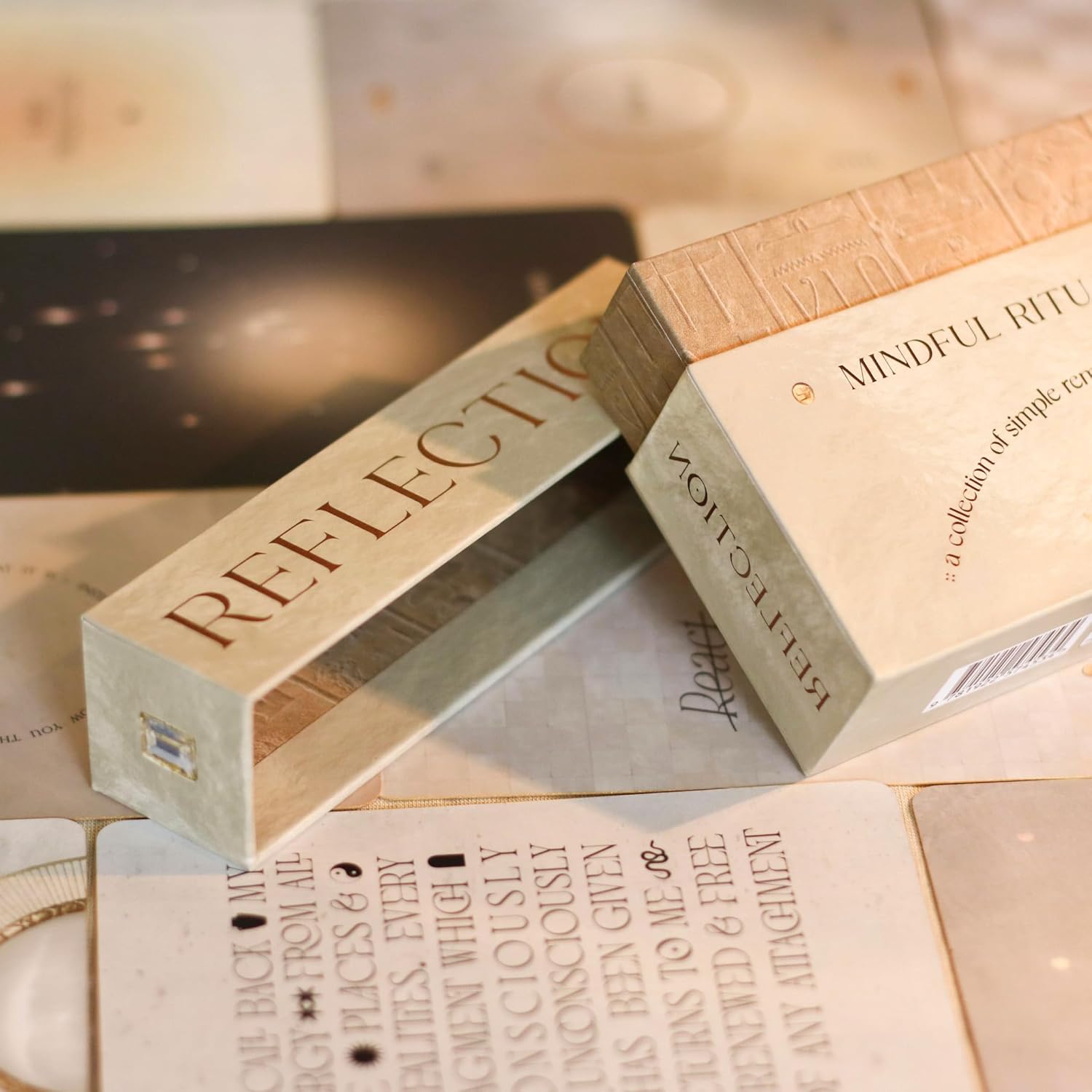 Two wooden boxes labeled 'Reflection' and 'Mindful Rituals' on a textured surface.