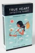 True Heart Intuitive Tarot guidebook and deck packaging with illustration of a woman holding a flower and a bag.