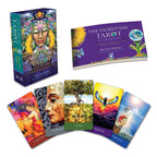 The Sacred She Tarot set with tarot cards and guidebook on a white background