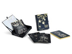 Black and gold tarot card set with packaging on a white background