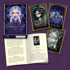 Oracle cards and book on a purple background