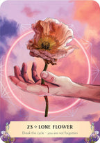 Card with a hand holding a lone flower against a mystical background
