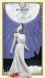 Card featuring a woman in a white dress with a wolf's head, howling at the moon, with a crab at the bottom.