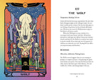 An open book showing the 'The Wolf' tarot card from The Major Arcana. The left page features a colorful, illustrated tarot card with a wolf, a skeleton, and a cauldron, while the right page displays the corresponding text explanation on a white background.