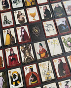Collection of tarot cards with intricate artwork on a dark surface