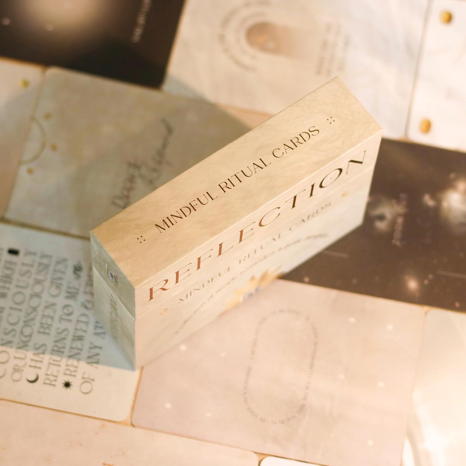 Box of 'Mindful Ritual Cards' with text on a textured surface