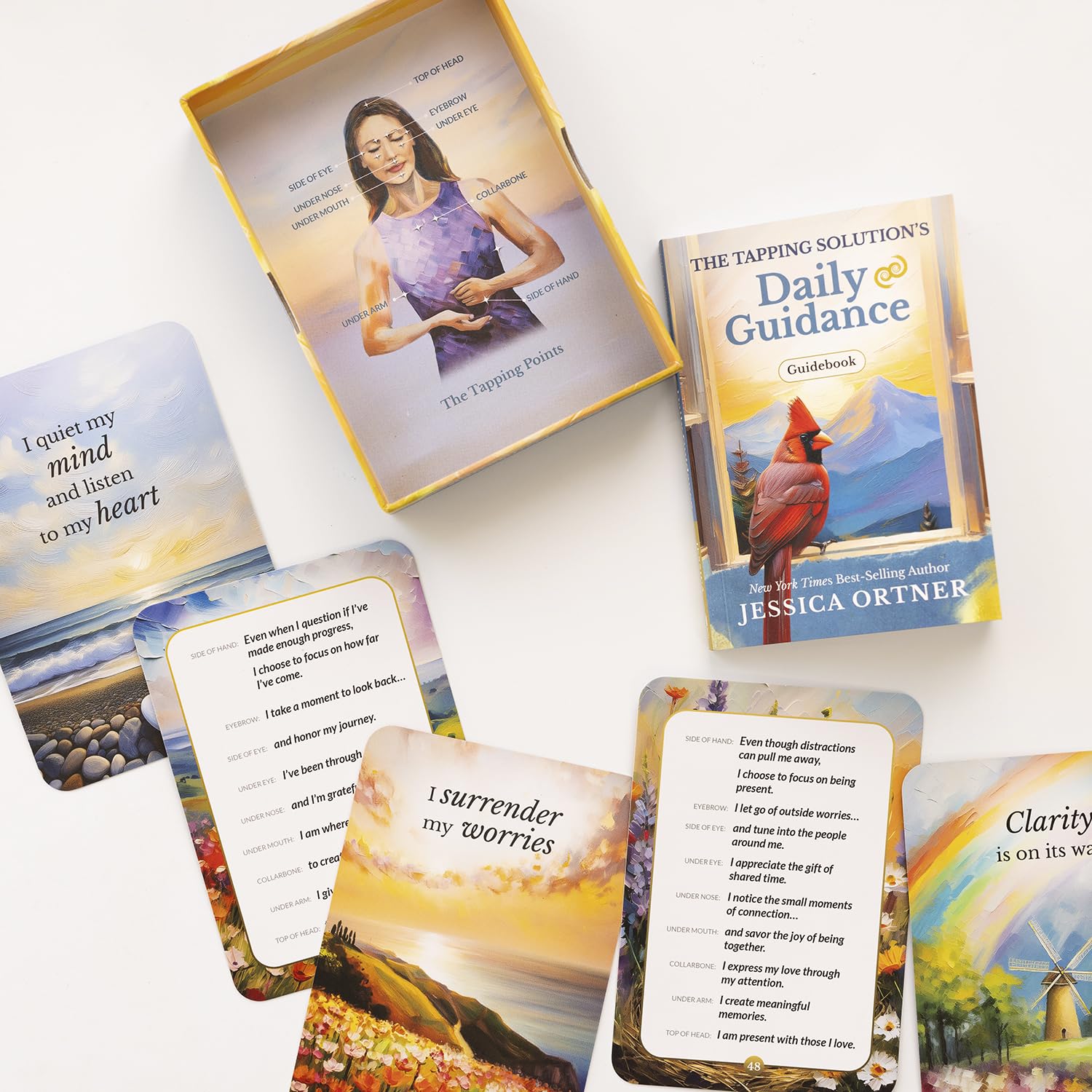 Set of tarot cards with a box labeled 'The Tapping Solutions Daily Guidance' by Jessica Ortner on a white background.