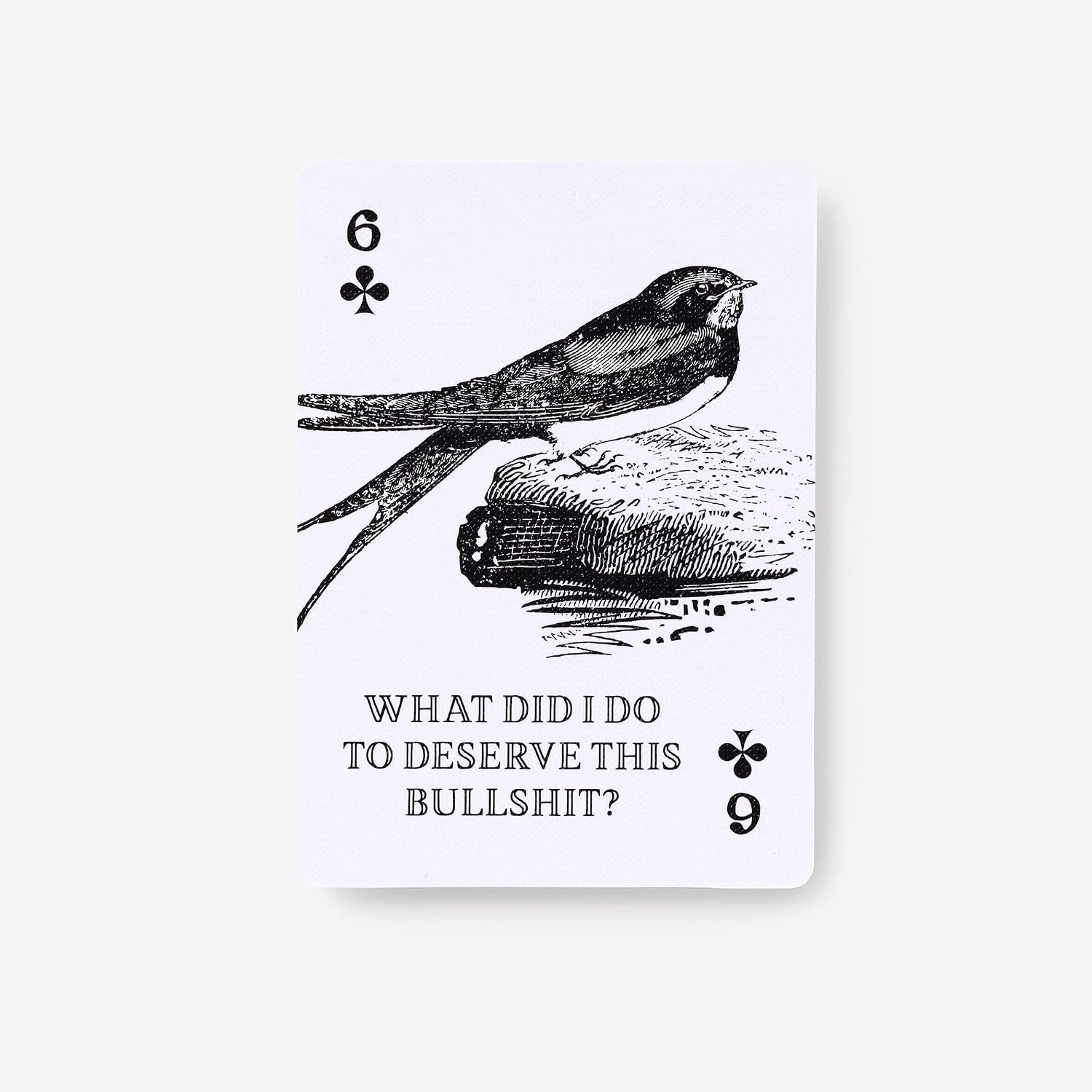 A single playing card shown upright on a light gray background. The card is white with black printed artwork of a bird perched on a log, with the text 'WHAT DID I DO TO DESERVE THIS BULLSHIT?' and playing card numbers and symbols.