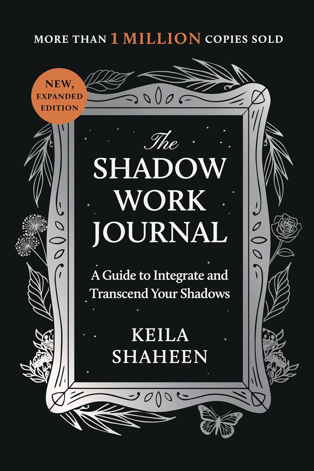 The Shadow Work Journal book cover by Keila Shaheen, featuring a black background with a silver ornate frame, white text, and a small orange circular badge that reads 'New, Expanded Edition.'.