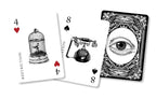 Three playing cards with unique designs on a white background
