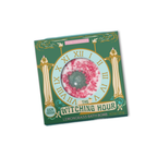Bath bomb packaging with decorative design and text on a white background